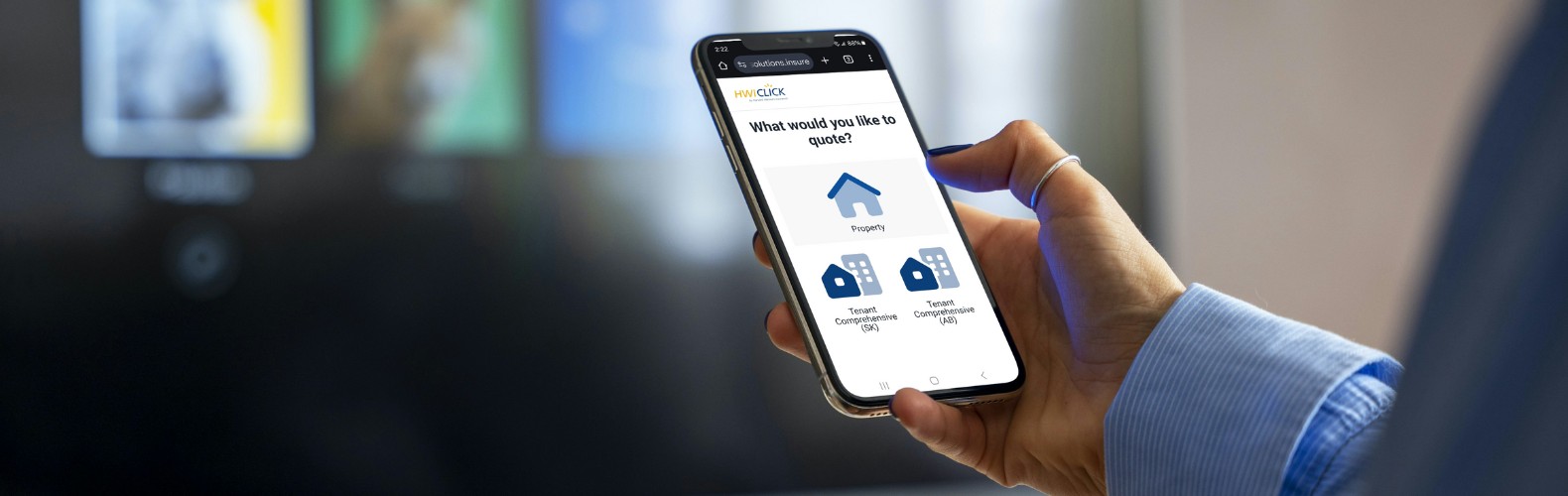 woman holding a smartphone with HWIClick to purchase tenant insurance for Saskatchewan or Alberta (1)